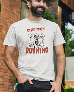 Creep Effin' Running Tee, Tee for Runners. Halloween shirt for people who run creepy. Monster zombie like graphic that reminds you to run or die. Creeping it real tee for men and women. You'd better run, or else. Unleash your inner runner this Halloween with the "Creep Effin' Running" tee. Whether you're racing through haunted trails or just getting into the Halloween spirit, this tee will have you running scared--in the best way possible. Icomfortable as it is eerie. Get ready to creep it real this Halloween! Style: Premium, super soft tee. Retail fit, a bit more tailored with the perfect amount of stretch. Fit: Bella Canvas premium tee. Unisex Sizing, runs true to size; refer to our sizing chart to find your perfect fit, women may want to size down.  Fabrication: Ash and Heather Prism co Running Scared, Creep It Real, Creepy Monster, Halloween Style, Halloween Spirit, Prism Color, Spirit Halloween, Sizing Chart, Halloween Shirt