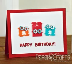 a happy birthday card with two monsters on the front and one is red, white and blue