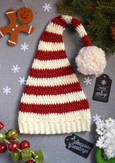 a crocheted christmas hat and other holiday decorations