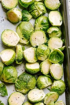 brussel sprouts on a baking sheet ready to be cooked in the oven