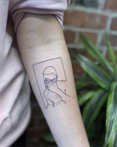 a person with a tattoo on their arm