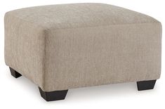 the foot stool is upholstered with black legs and a light colored fabric cover