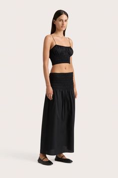 A mid-rise midi skirt with a channelled elastic waist, made from 100% organic cotton poplin. Lightweight and airy, the wide fitted waist falls into a relaxed semi-flared skirt. Pair with the Baia Top for a matching set. Black Gathered Skirt For The Beach, Black Cotton Beach Skirt, Black Cotton Flowy Maxi Skirt, Black Gathered Beach Skirt, Cotton A-line Maxi Skirt With Gathered Detail, Faithfull The Brand, Maxi Dress Sale, Black Midi Skirt, Black Crop