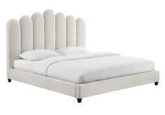 a bed with white linens and headboard made to look like it has four posts