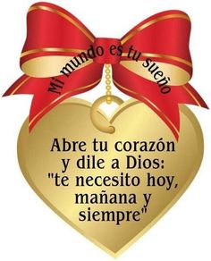 a gold heart with a red ribbon and a quote from the spanish language on it