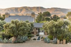 a house with mountains in the background