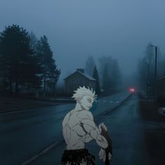 a man with white hair is walking down the street in the foggy night time