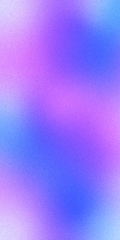 a blurry image of blue and pink colors