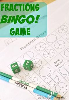 two green dices sitting on top of a sheet of paper next to a pencil