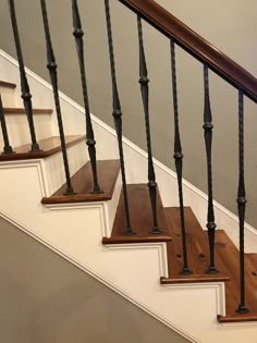 a set of stairs with wooden handrails