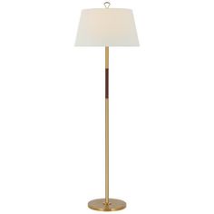 a floor lamp with a white shade on the top and a gold metal base, against a white background