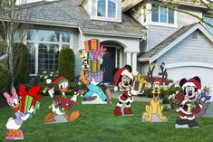 mickey mouse lawn decorations in front of a house