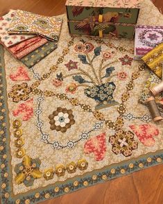 an area rug with various items on it, including a box and some other things