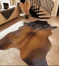 an animal hide rug on the floor in a living room