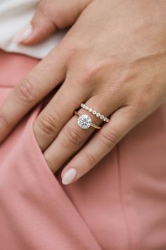 a woman's hand with a ring on her finger