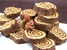 a pile of cut up brownies with a squirrel figurine on top