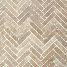 an image of a herringle tile pattern in brown and white colors on the floor