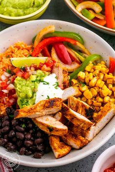 a white bowl filled with chicken, rice and beans next to other bowls of food