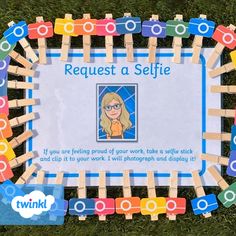 a sign with clothes pins attached to it that says request a selfie