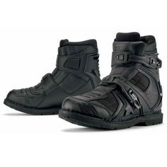 a pair of black motorcycle boots on a white background