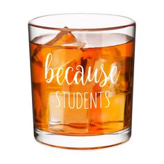 a glass filled with liquid that says because students