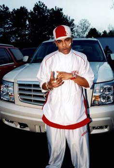 a man standing in front of a white truck