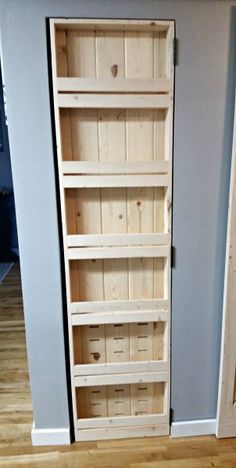 an empty bookcase in the corner of a room