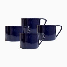 three blue coffee mugs sitting next to each other