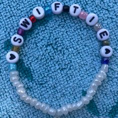 Taylor Swift Eras Clay Bead Bracelet, Eras Clay Bead Bracelet, Bracelet Ideas For Taylor Swift, Taylor Swift Eras Tour Necklace, Taylor Swift Inspo Bracelets, Tay Swift Bracelets, Taylor Swift Concert Outfit Ears, Back To December Taylor Swift Bracelet, Eras Tour Bracelet Ideas Pony Beads