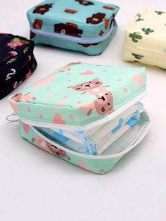 four different colored bags with animals on them