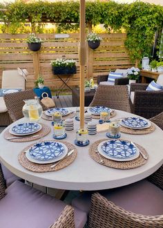 the table is set with blue and white plates