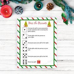 a printable christmas party pass the present game on top of a white wooden table