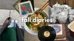 there is a bowl of noodles with chopsticks in it and an album on the table