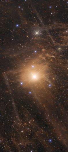 an image of the sky with stars and bright light in it, taken from space