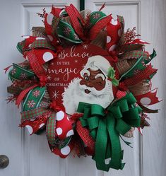 a christmas wreath that says believe in the magic of christmas with santa clause on it