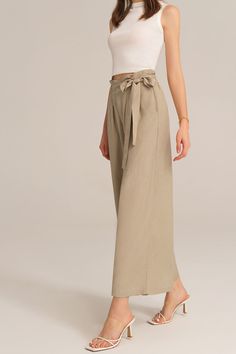 Experience the perfect blend of comfort and style with this casual elastic waist wide leg pants. This pants are designed for versatility and effortless elegance, making them a must-have for any casual occasion. Embrace a relaxed and chic look that is both comfortable and fashion-forward.Material : 75%Viscose+25%LinenElasticity : NoneSku : CL2814S24*Package : 1*PantsCare instructions:Do Not Bleach.Separate dark colors.Iron Low Heat. Casual Non-stretch Khaki Wide Leg Pants, Khaki Wide Leg Cargo Pants, Versatile Solid Culottes For Spring, Versatile Wide-leg Pants With Tie Waist, Khaki Wide Leg Ankle-length Pants With Relaxed Fit, Khaki Wide Leg Ankle-length Pants With Loose Fit, Khaki Wide Leg Ankle-length Pants With Elastic Waistband, Khaki Ankle-length Wide Leg Pants With Elastic Waistband, Relaxed Fit Wide Leg Pants With Tie Waist