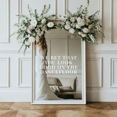 a photo frame with flowers and a quote on the front that says, we bet that you look good on the dancefloor