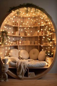 a circular bed with lots of lights on the wall and shelves above it, along with a teddy bear