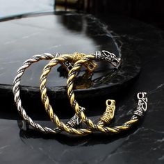 Unleash your inner warrior with this Viking Wolf Head Torque Bracelet 🐺. Inspired by Norse mythology, this bold and rugged design symbolizes strength, courage, and loyalty 💪. Features: 💪 The bracelet features a durable plating in three unique, high-quality colors, ensuring long-lasting style and resistance to wear. ✅ Adjustable size for a comfortable fit for all wrist sizes.  ⚒️ Made from high-quality antique silver-tone metal combined with durable stainless steel and durable plating, ensurin Viking Wolf, Bracelet Inspired, Bracelet Viking, Viking Culture, Viking Bracelet, Wolf Head, Celtic Designs, Norse Mythology, Inspired Jewelry