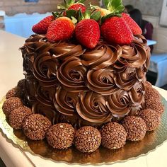 a chocolate cake with strawberries on top