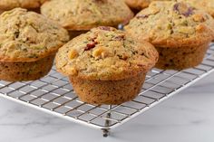 several muffins sitting on a cooling rack