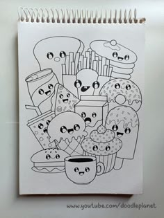 a drawing of donuts and cupcakes with faces drawn on them in black ink