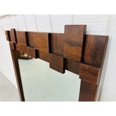 a mirror that is made out of wood