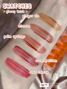 swatches on the arm of a woman in pink and red lipsticks, all with different colors