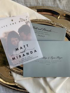 save the date cards on a silver tray