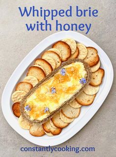 a white plate topped with crackers and cheese