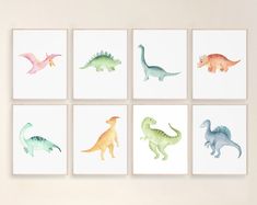 six dinosaur prints in pastel colors are displayed on the wall above a white table