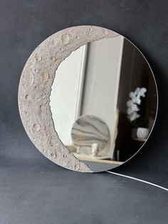 a mirror that is sitting on the wall