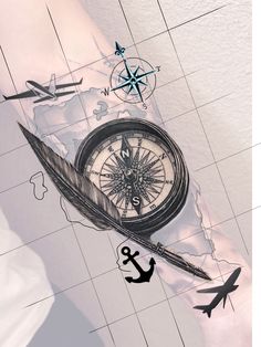 a person's arm with a compass and an anchor on it, in front of a map