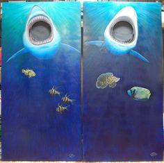 two painted doors with fish and sharks on them